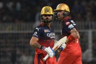 Virat Kohli and Phil Salt (in background) playing for RCB against Kolkata Knight Riders - Source: Getty